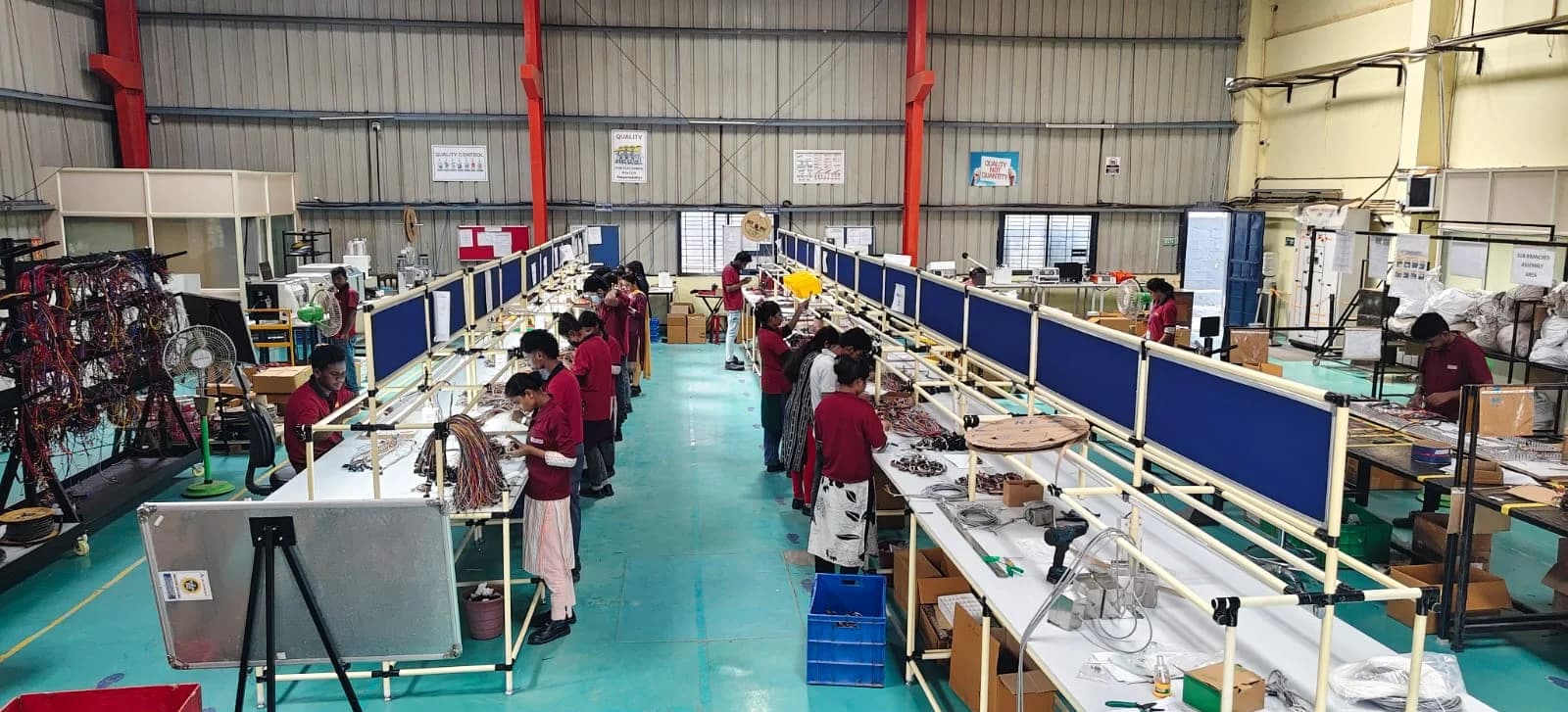 Operators at the harness assembly lines on the MGTPL shop floor in Bengaluru.